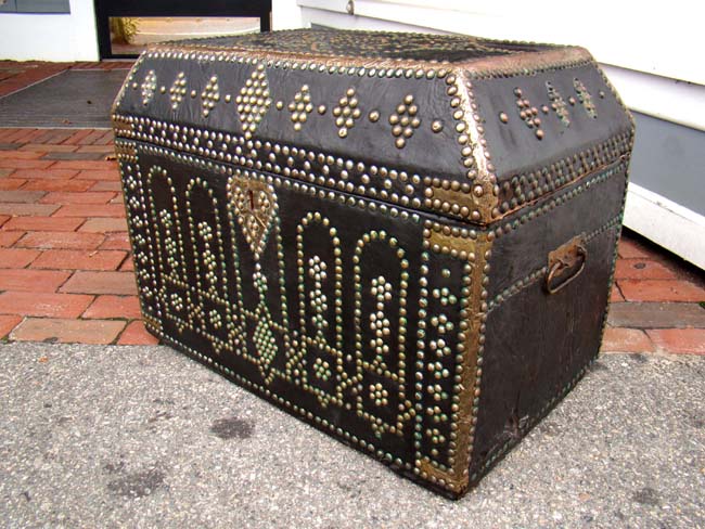 A late 18th or early 19th century brass decorated leather trunk with canted top — image 2